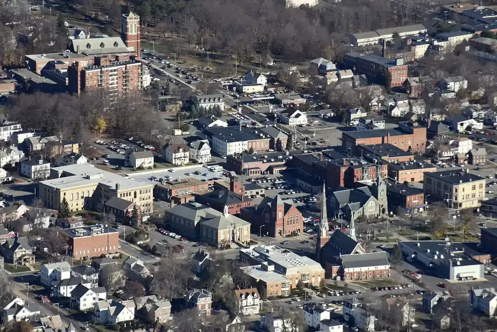 Aerial view of downtown Leominster, Massachusetts, with brick blocks, church steeples and surrounding homes