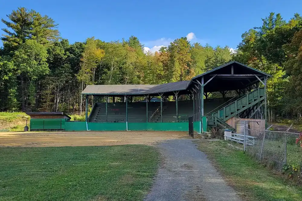The covered wooden grandstand at O'Gara Park ball field in Spencer, Massachusetts