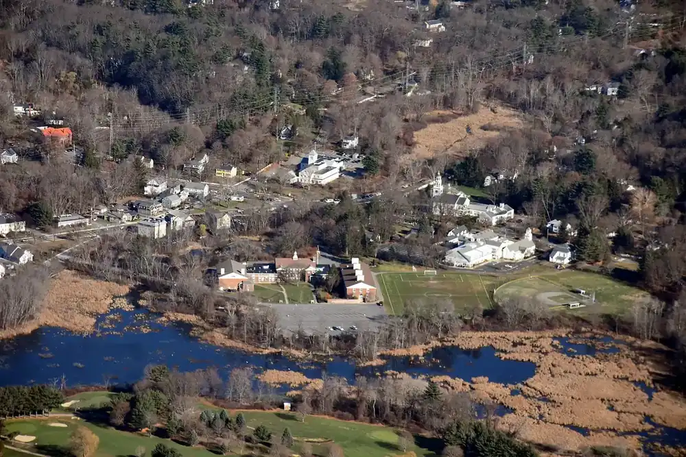 Aerial view of Wayland town center, its homes, wetlands and river in Massachusetts